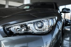 Modern luxury car close-up Concept of expensive sports auto Headlight lamp of new cars